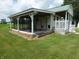Dog kennel with covered runs, white picket fence, and convenient access to green space at 3310 W State Road 58, Seymour, IN 47274