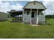 Dog kennel with covered runs, a white picket fence and convenient access to green space at 3310 W State Road 58, Seymour, IN 47274