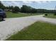 Gravel driveway shows turn around area surrounded by green lawn at 3310 W State Road 58, Seymour, IN 47274