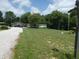Extensive lawn with a gravel driveway and large multi-car carport provide ample parking at 3310 W State Road 58, Seymour, IN 47274