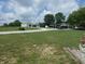 Gravel drive leads to a large multi-bay carport and separate storage building at 3310 W State Road 58, Seymour, IN 47274