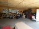 Spacious garage featuring wood paneled walls and ceiling, tools, and ample space at 3310 W State Road 58, Seymour, IN 47274