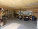 Spacious garage with wood paneled walls and ceiling, tools and ample workspace at 3310 W State Road 58, Seymour, IN 47274