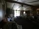 Open living room with wood paneling, ceiling fan, comfortable seating with french doors to the outside at 3310 W State Road 58, Seymour, IN 47274