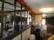 Spacious living room featuring a charming wooden accent wall decorated with a seasonal fall decor and an open floor plan at 3310 W State Road 58, Seymour, IN 47274