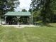 Backyard pavilion featuring picnic seating, grill, and view of the pond at 3310 W State Road 58, Seymour, IN 47274