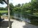 Scenic view of a serene pond surrounded by lush greenery, perfect for relaxation and enjoying nature's tranquility at 3310 W State Road 58, Seymour, IN 47274