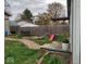 Expansive backyard featuring a wooden fence, patio area and play equipment at 3330 S Mooresville Rd, Indianapolis, IN 46221