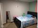 This bedroom is cozy and inviting, with blue accents and a comfortable bed at 3330 S Mooresville Rd, Indianapolis, IN 46221