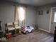 Extra bedroom featuring laminate flooring at 3330 S Mooresville Rd, Indianapolis, IN 46221