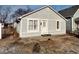 Charming single-story home with gray siding, well-maintained lawn, and inviting entrance at 3330 S Mooresville Rd, Indianapolis, IN 46221