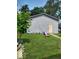 This property includes a single car garage with a door on a well-maintained lawn at 3330 S Mooresville Rd, Indianapolis, IN 46221