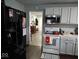 Efficient kitchen with wooden floors, appliances and access to another room at 3330 S Mooresville Rd, Indianapolis, IN 46221