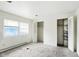 Spacious bedroom featuring neutral carpet flooring, bright windows and large closets at 3343 Ashley Ln, Indianapolis, IN 46224