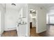 Practical kitchen with countertops and a view of the adjacent laundry area and living space at 3343 Ashley Ln, Indianapolis, IN 46224