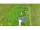 Aerial view of a home on a large lot with playset and shed surrounded by a green lawn at 3450 Clay Rd, North Salem, IN 46165