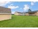 View of home's backyard featuring a sunroom, covered patio, and storage shed at 3450 Clay Rd, North Salem, IN 46165