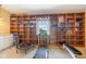 Finished basement with wood built-in shelves and exercise equipment at 3450 Clay Rd, North Salem, IN 46165