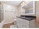 Clean bathroom with granite counters, a framed mirror, and white cabinets at 3450 Clay Rd, North Salem, IN 46165
