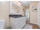 Bathroom with a granite counter, mirror and white cabinets at 3450 Clay Rd, North Salem, IN 46165