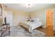 Bedroom with a queen bed, an ensuite bathroom, and wood flooring at 3450 Clay Rd, North Salem, IN 46165