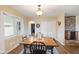 Open dining area with rustic table, stylish lighting, and inviting ambiance at 3450 Clay Rd, North Salem, IN 46165