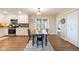 Dining room adjoining white kitchen, featuring a modern stove and beautiful backsplash at 3450 Clay Rd, North Salem, IN 46165