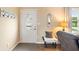 Inviting entryway featuring a decorative door, mirror, and cozy bench at 3450 Clay Rd, North Salem, IN 46165
