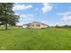 Spacious home exterior with well-maintained lawn and attached garage on a sunny day at 3450 Clay Rd, North Salem, IN 46165