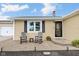 Inviting front porch with stone pavers and rocking chairs, perfect for relaxing at 3450 Clay Rd, North Salem, IN 46165