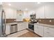 Bright kitchen featuring stainless appliances, modern cabinets, and stone countertops at 3450 Clay Rd, North Salem, IN 46165