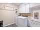 Functional laundry room featuring white appliances and cabinets at 3450 Clay Rd, North Salem, IN 46165
