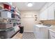 Laundry room featuring shelving, sink, and full-size washer and dryer at 3450 Clay Rd, North Salem, IN 46165