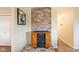Living room with brick accent wall and custom wood burning heater at 3450 Clay Rd, North Salem, IN 46165