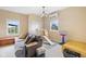 Bright living room featuring a comfortable couch, play gym, and ample natural light at 3450 Clay Rd, North Salem, IN 46165