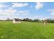 Spacious yard with storage shed, playset, and lush green lawn for outdoor activities at 3450 Clay Rd, North Salem, IN 46165