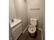This is a full bath with laminate flooring, a toilet and vanity at 3525 Lombardy Pl, Indianapolis, IN 46226