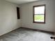 Cozy bedroom with neutral paint, fresh carpet, and a sunny window at 3525 Lombardy Pl, Indianapolis, IN 46226