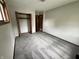 Empty bedroom features neutral paint, new carpet, and closet at 3525 Lombardy Pl, Indianapolis, IN 46226
