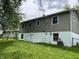 This exterior shows the siding on this two story home, as well as the white painted block foundation at 3525 Lombardy Pl, Indianapolis, IN 46226