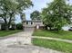 Exterior view of a cozy home showcasing a two-story design and a well-maintained lawn at 3525 Lombardy Pl, Indianapolis, IN 46226