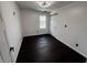 Bedroom with hardwood floors and bright windows at 3962 Graceland Ave, Indianapolis, IN 46208