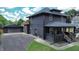 Charming two-story home with a black exterior, a detached garage, and a well-maintained lawn at 3962 Graceland Ave, Indianapolis, IN 46208