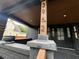 Covered front porch with address displayed on post in decorative font at 3962 Graceland Ave, Indianapolis, IN 46208