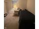 Simple bedroom with twin bed, nightstand, lamp, and carpeted floors at 4404 London Ct, Indianapolis, IN 46254