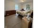 This bedroom has 2 windows, dresser, and an unmade bed with an ugly comforter at 4404 London Ct, Indianapolis, IN 46254