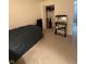 Carpeted bedroom featuring a twin bed and aquarium at 4404 London Ct, Indianapolis, IN 46254
