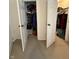 This walk-in closet is open and filled with a lot of items for storage at 4404 London Ct, Indianapolis, IN 46254