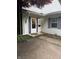 Inviting front entrance with a storm door and exterior lighting at 4404 London Ct, Indianapolis, IN 46254