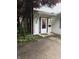 A well-lit entryway featuring a storm door and charming details at 4404 London Ct, Indianapolis, IN 46254